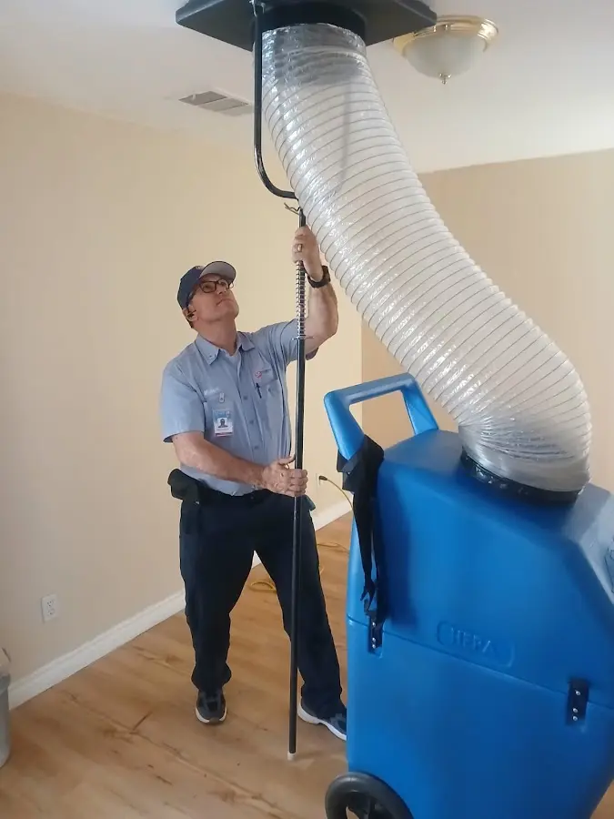 Furnace Tune-Up technician using HEPA equipment in Country Club Hills